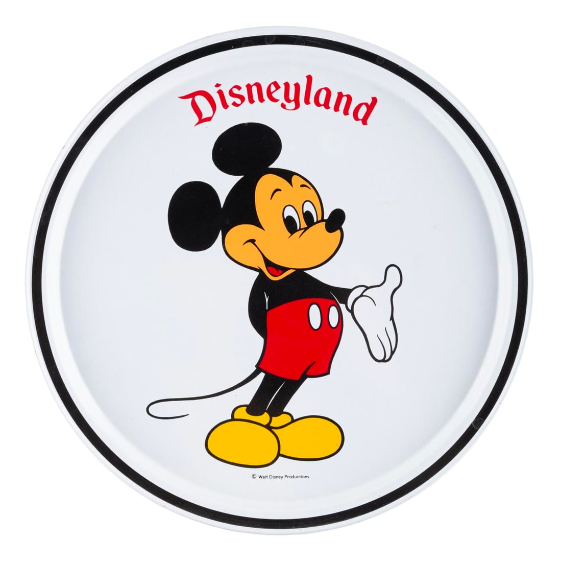 A Disneyland Mickey Mouse Tray.: (Disneyland, 1980s) A Disneyland decorative tray featuring Mickey Mouse. Measuring 10.75" in diameter, the metal tray is in good condition with scratches, spots of discoloration, wear, and a pricing s