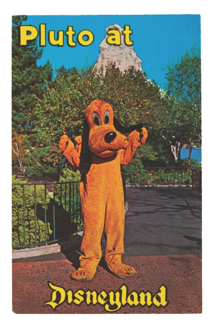 A "Pluto at Disneyland" Postcard.: (Disneyland, 1960s) A postcard of Pluto in Disneyland. The card is in very good condition with a slight bend to one corner.