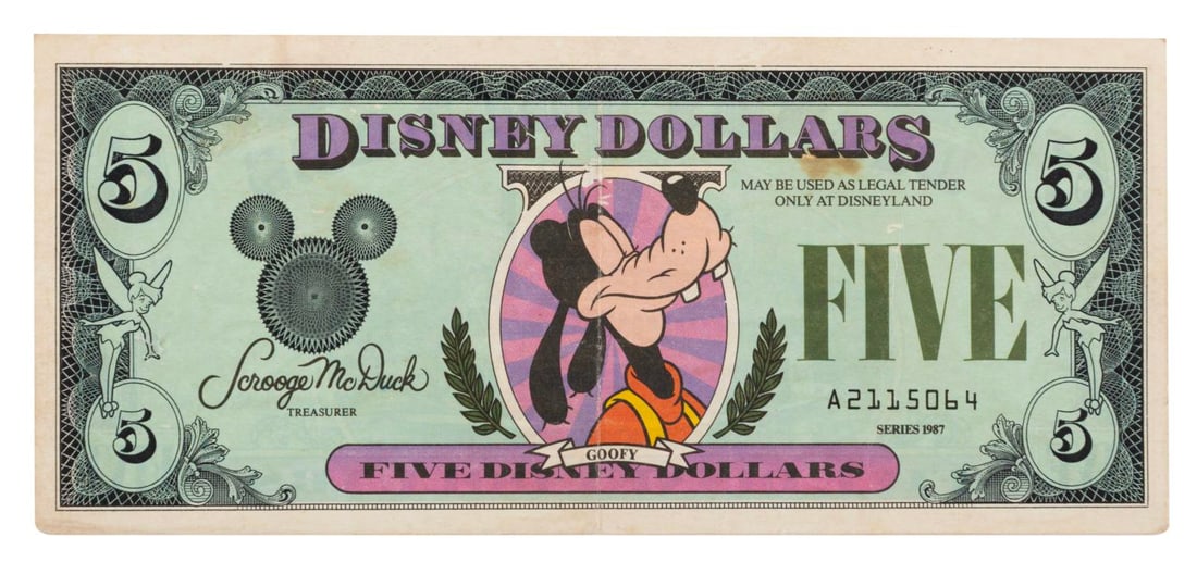 A 1987 Disney Dollar Goofy Five Dollar Bill.: (Disney, 1987) A Goofy Five Disney Dollar bill, released in the first year of their issue, 1987. This bill is still worth the face value at Disneyland today. The bill is in good condition with