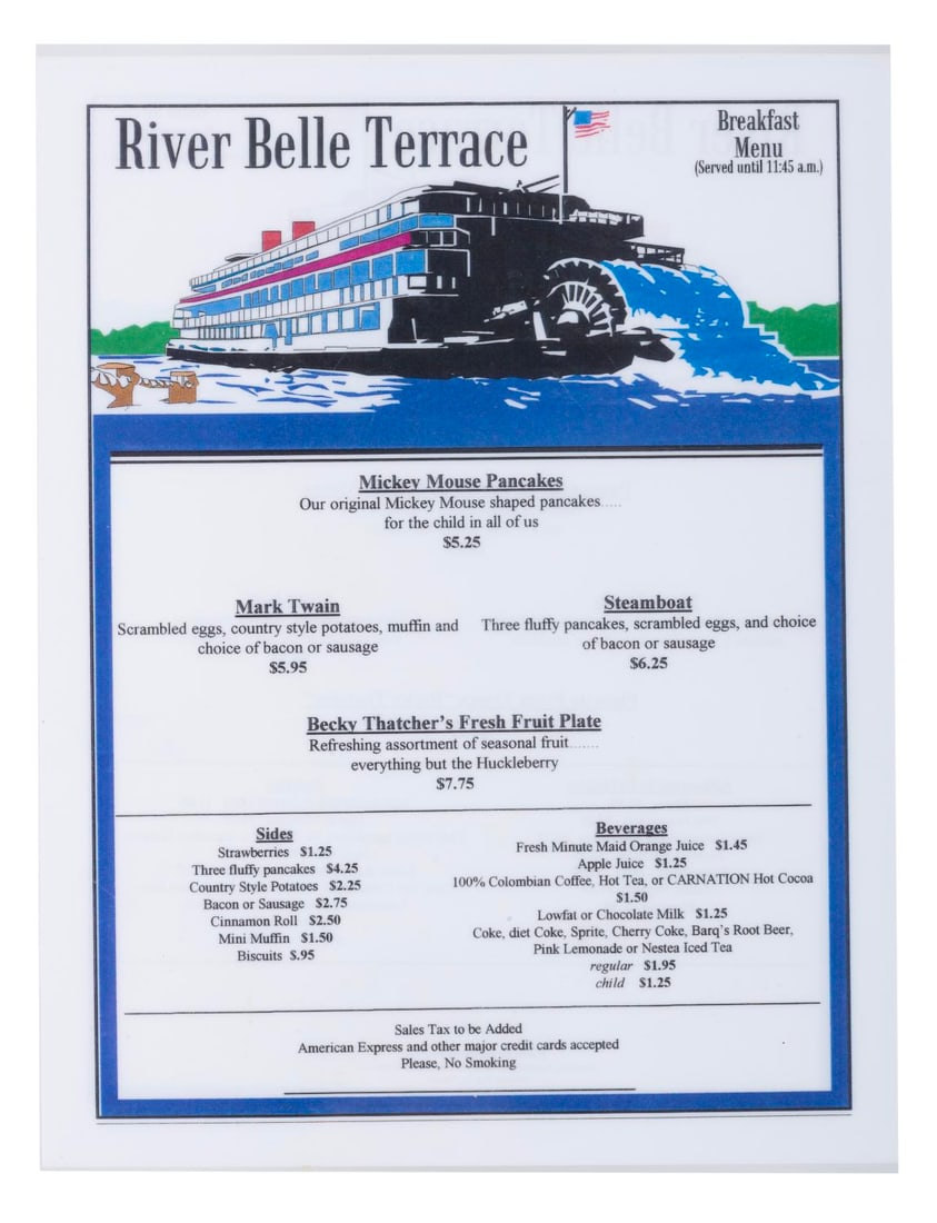 A Disneyland River Belle Terrace Breakfast Menu.: (Disneyland, 1990s) A breakfast menu from the River Belle Terrace in Frontierland. The double-sided menu features items in English on one side and Spanish on the reverse. Measuring 8.5" x 11.25", the