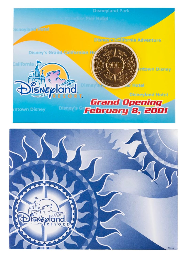 A 2001 Disneyland Resort Grand Opening Coin.: (Disneyland Resort, 2001) A commemorative coin for the Grand Opening of Disney?s California Adventure, Downtown Disney, and Disney?s Grand Californian Hotel, on February 8, 2001. The double-sided coin