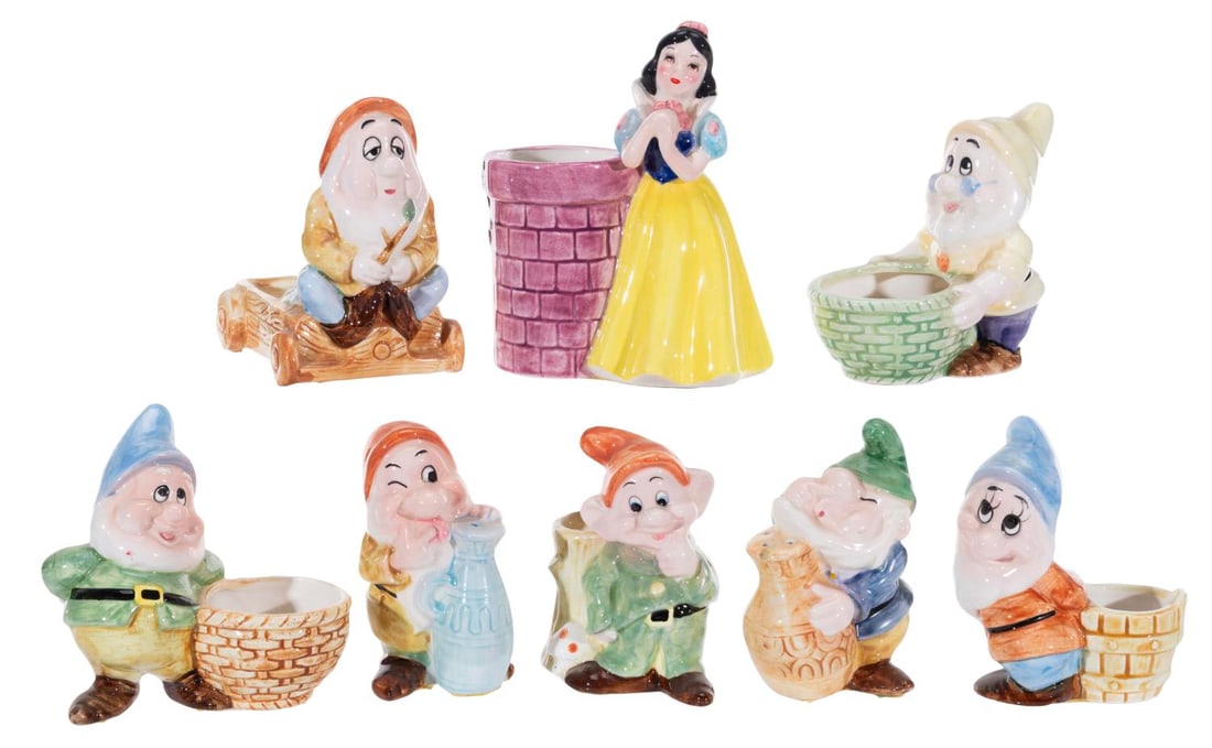 A "Snow White and the Seven Dwarfs" Ceramic Set.: (Tokyo Disneyland, 1980s) A set of eight ceramic souvenirs from Tokyo Disneyland of "Snow White and the Seven Dwarfs." Included are 5 planters, single salt and pepper shakers, and a trinket dish. Stan
