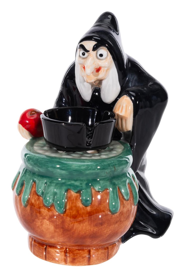 A Tokyo Disneyland "Snow White" Old Hag Incense Burner.: (Tokyo Disneyland, 1989) An incense burner of the Evil Queen as the Old Hag from "Snow White and the Seven Dwarfs." Measuring 4.25" x 3" x 4.75" tall, the ceramic incense burner is in very good condit
