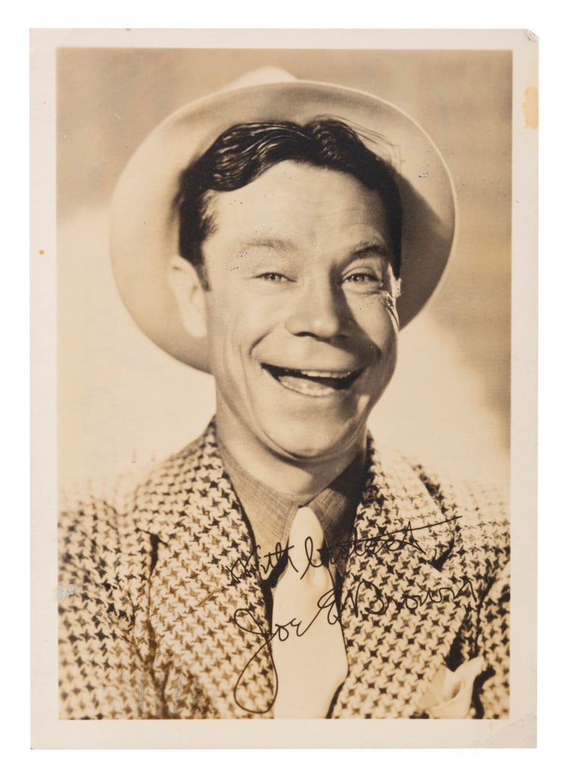 A Comedian Joe E. Brown Fan Card.: (Columbia, 1939) A fan card for the Joe E. Brown radio show. The front features a picture of Brown with preprinted signature, and the back the series air times. Measuring 3.5" x 5", the card is in