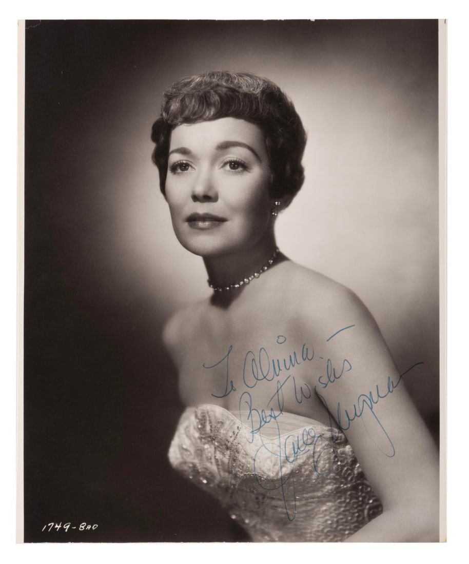 A Jane Wyman Signed Photograph.: (Warner Bros., 1940s) An autographed photo of actress Jane Wyman. Measuring 8" x 10", the photograph signed with a dedication is in very good condition with light edge wear and typical toning from