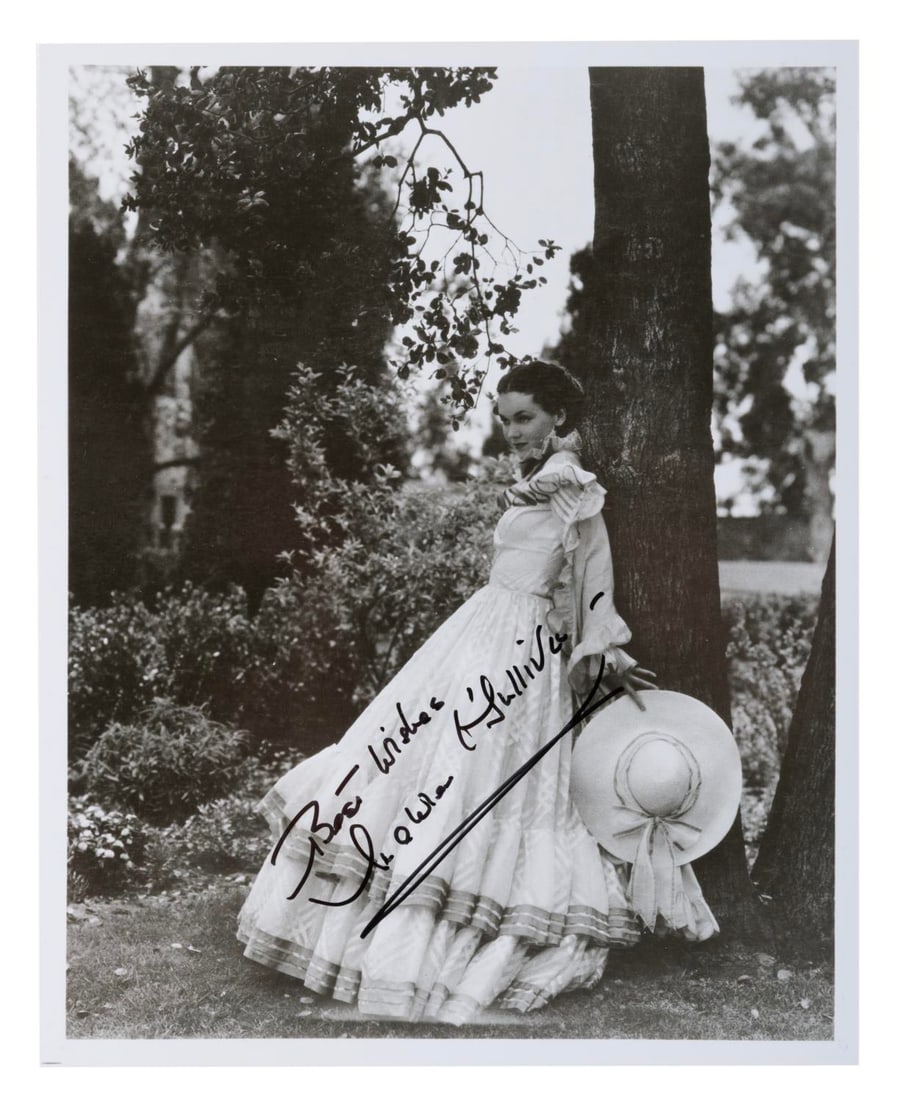 An Olivia de Havilland Signed "Gone With the Wind" Photograph.: (MGM, 1980s-90s) A signed photograph of actress Olivia de Havilland in her role as Melanie in "Gone With the Wind." De Havilland secured her first of five Oscar nominations for that supporting role.