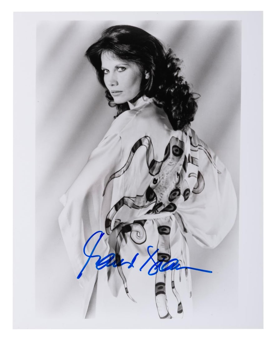 A Maud Adams "Octopussy" Signed Photograph.: (MGM/UA, 1980s) An autographed photo of Maud Adams as "Octopussy" in the 1983 James Bond film. Measuring 8" x 10", the signed photo is in fine condition.