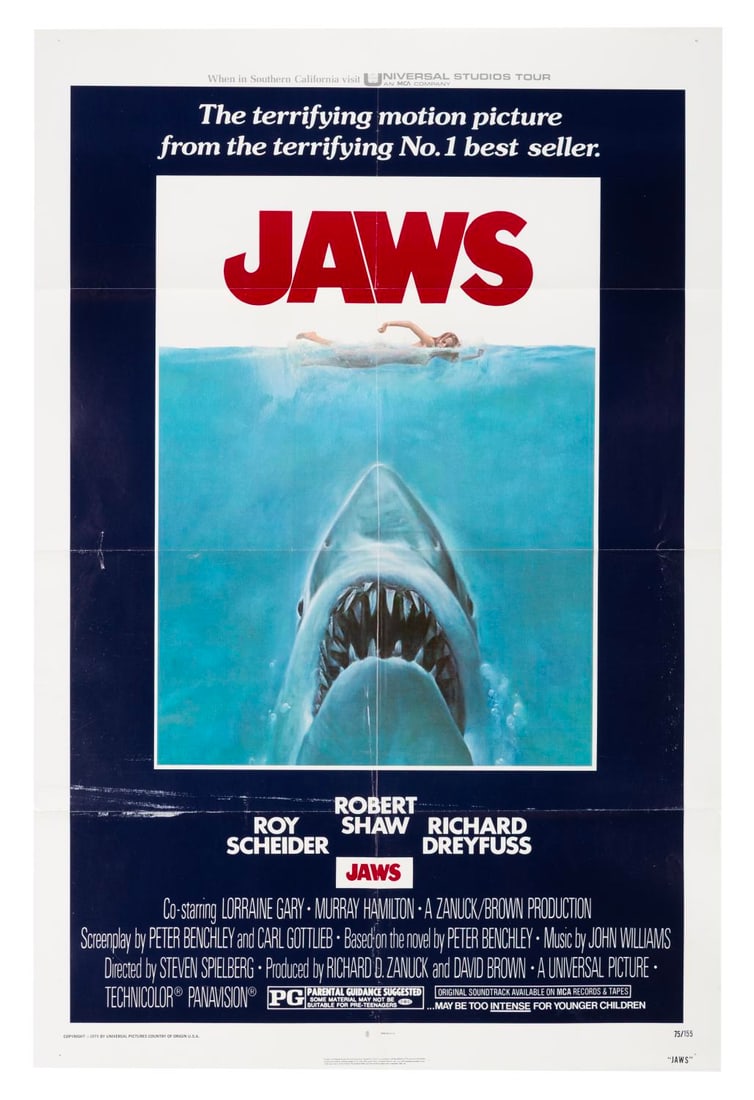 A "JAWS" One-Sheet.: (Universal, 1975) An original release one-sheet for Steven Spielberg's "JAWS." This variant features the invitation "When in Southern California visit Universal Studios Tour" along the top border, an 