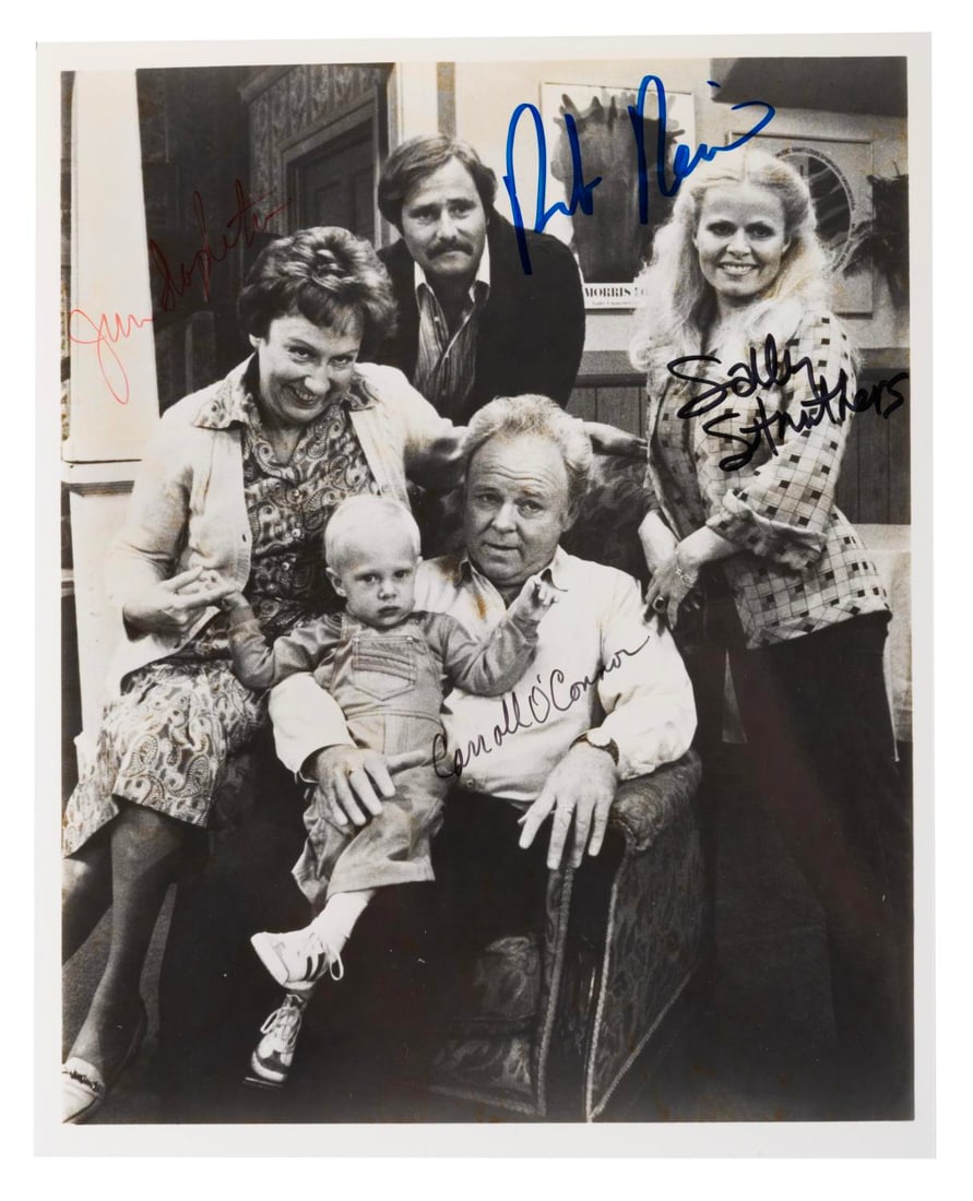 An "All in the Family" Cast-Signed Photograph.: (CBS, 1976) An "All in the Family" photo signed by the main cast members. Autographs include Carroll O?Connor (Archie), Jean Stapleton (Edith), Sally Struthers (Gloria), and Rob Reiner as Michael