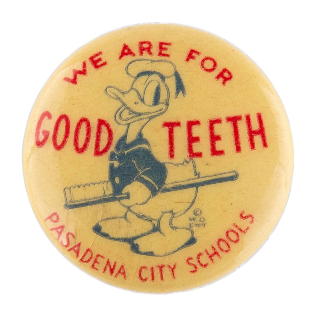 A Donald Duck "Good Teeth" School Pin.: (Disney, 1930s) A We Are For Good Teeth Pinback Button from Pasadena City Schools, featuring Donald Duck. Measuring 1" in diameter, the button is in very good condition with light discoloration from