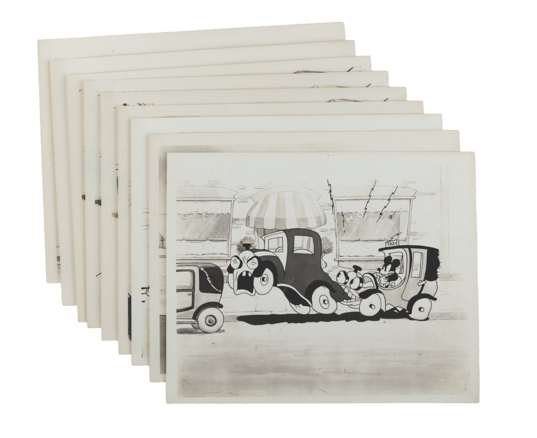 A Collection of "Traffic Troubles" Photos.: (Disney, 1970s-90s) A collection of nine photos of the Mickey and Minnie Mouse short "Traffic Troubles." Measuring 8" x 10" each, the prints are in good to very good condition with creases,