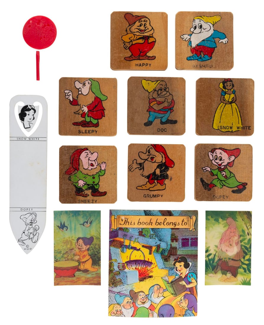 A "Snow White and the Seven Dwarfs" Memorabilia Collection.: (Disney, 1930s-50s) A collection of early "Snow White and the Seven Dwarfs" memorabilia. Included are two lenticular images, a bookmark, a cupcake topper, a book plate, and eight wooden alphabet/numbe