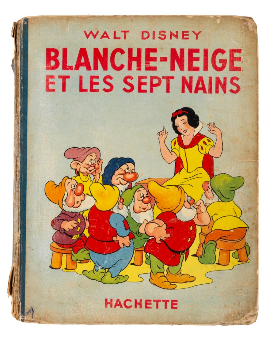 A Walt Disney's "Blanche-Neige et les Sept Nains" Book.: (Hachette, 1938) A French "Snow White and the Seven Dwarfs" storybook by Hachette. Measuring 7.25" x 9.25", the book is in fair condition with heavy spine wear, discoloration from age, creases, ink ma