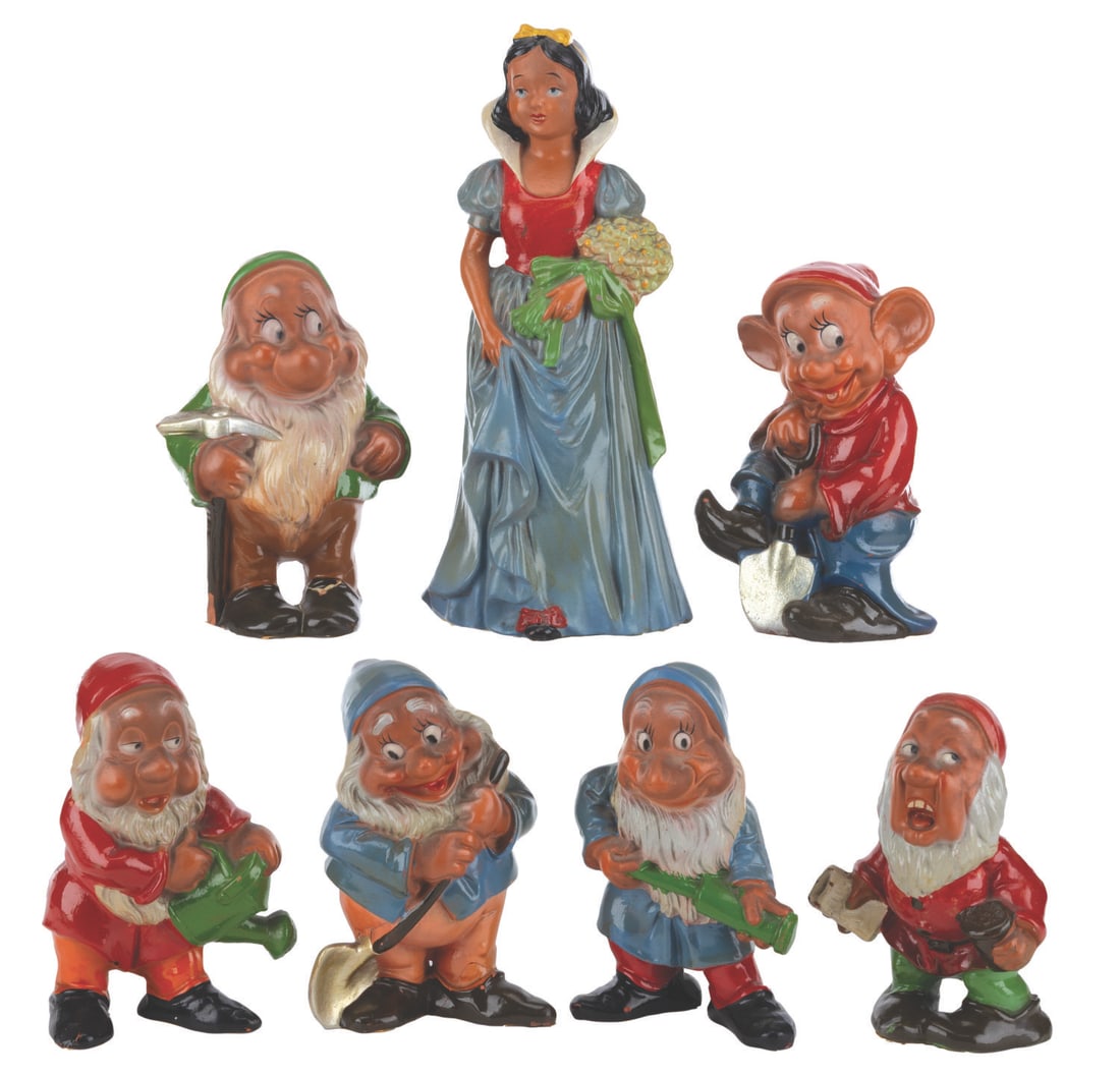 A Set of "Snow White and the Seven Dwarfs" Terracotta Figurines.: (Continental, 1930s-40s) A complete set of eight terracotta "Snow White and the Seven Dwarfs" figurines. Ranging in size from 6" to 10" tall, the set displays in good to very good condition with heavy