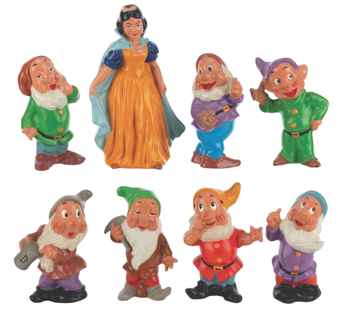 A Set of German "Snow White and the Seven Dwarfs" Figurines.: (1960s) A complete set of eight "Snow White and the Seven Dwarfs" figurines, manufactured in Germany. Ranging in size from 5.25" to 7.5" tall, the ceramic figurines display in very good condition with