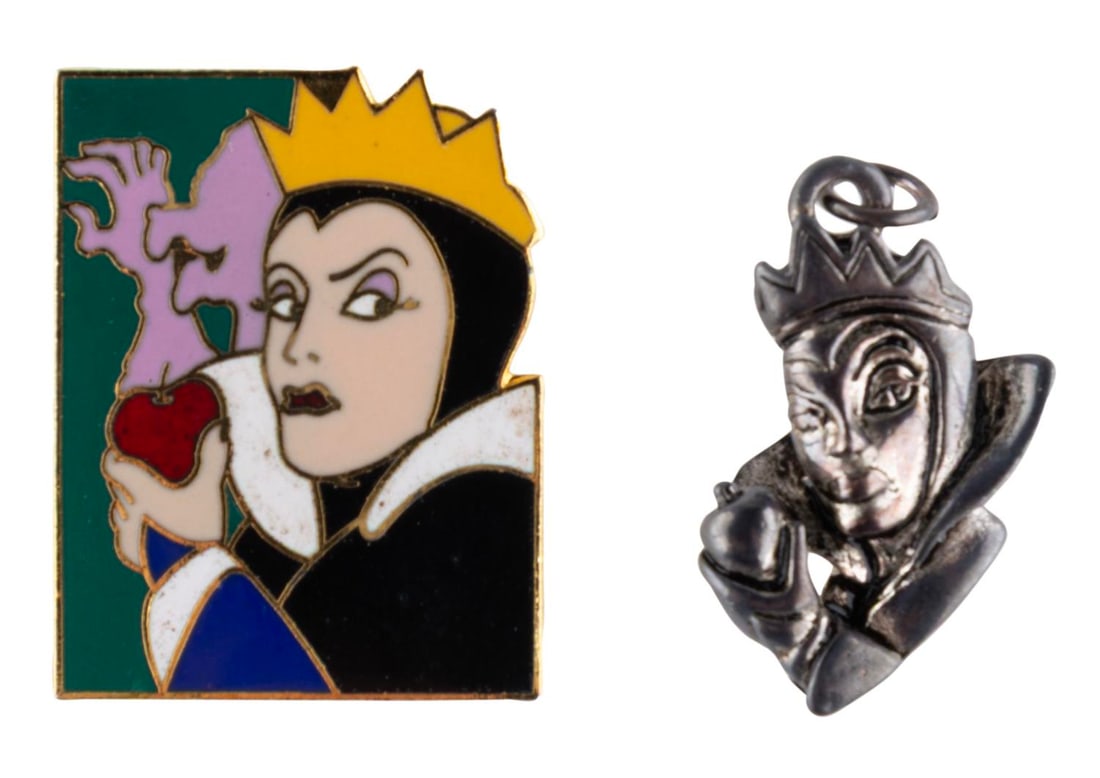 A "Snow White" Evil Queen Pin and Silver Charm.: (Disney, 1990s) A "Snow White and the Seven Dwarfs" Evil Queen cloisonne pin and sterling silver charm. The charm and pin are in good condition with the pin displaying discoloration and soiling,