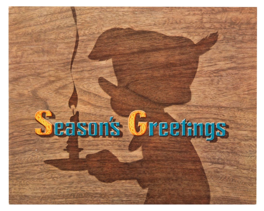 A 1939 Walt Disney Studio "Pinocchio" Christmas Card.: (Disney, 1939) A rare 1939 Walt Disney Studios Christmas Card featuring the cast of the Studio's upcoming feature "Pinocchio." Measuring 6" x 7.5" closed, the card is in very good condition with