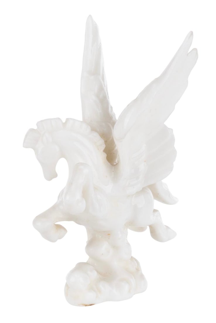 A "Fantasia" Pegasus Ceramic Figurine.: (Disney, 1940s-60s) A ceramic Pegasus from the Pastoral Symphony sequence of "Fantasia." Measuring 2.25" tall, Pegasus is in very good condition with light soiling and adhesive residue on the base.