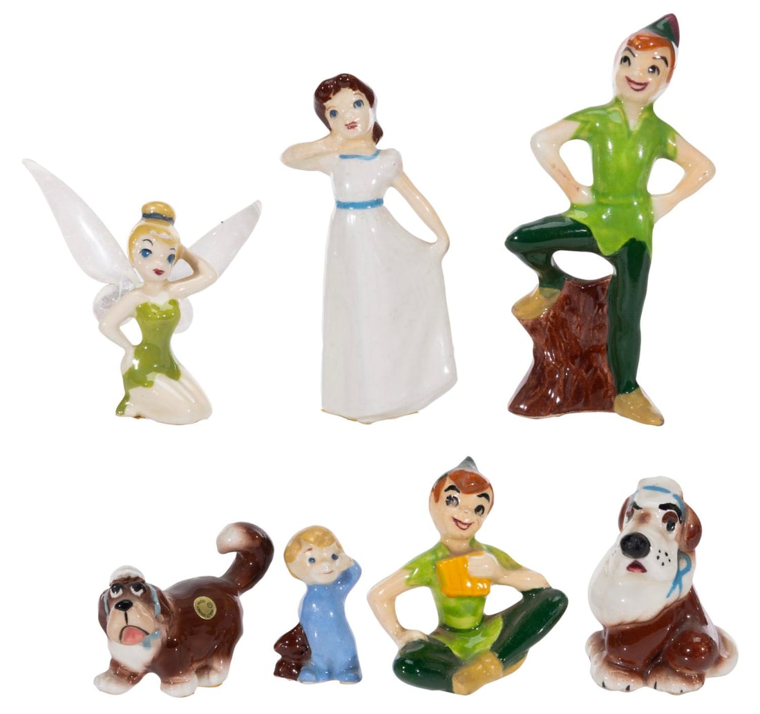 A Collection of "Peter Pan" Miniature Figurines.: (Shaw/ Hagen-Renaker, 1940s/50s) A collection of seven miniature figurines of characters from "Peter Pan." Included are Tinker Bell, Nana, Wendy, Michael, and two of Peter manufactured by Evan K. Shaw