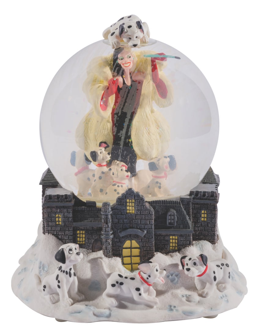 A "101 Dalmatians" Cruella De Vil Musical Snow Globe.: (Disney Store, 1990s) A snow globe from "One Hundred and One Dalmatians" with a musical feature that plays "Cruella De Vil." Measuring 7" in diameter x 7.25" high, the resin and glass globe is in
