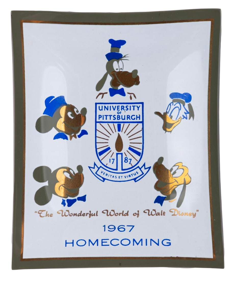 A University of Pittsburgh 1967 Disney Glass Ashtray.: (Pittsburgh, 1967) A smoked glass ashtray featuring Disney characters for the 1967 University of Pittsburgh homecoming. The ashtray bears the line "The Wonderful World of Disney" beneath the