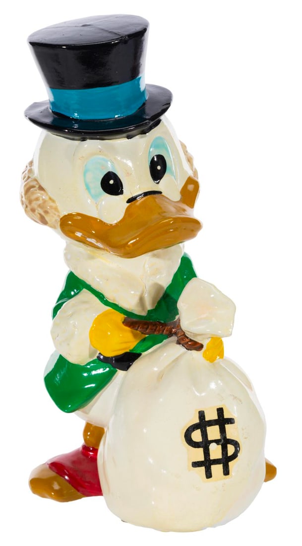 A Scrooge McDuck Figural Bank.: (Disney, 1960s-70s) A Scrooge McDuck figural bank, manufactured in Japan. Measuring 8.25" tall, the bank is in fair condition with heavy paint chipping, paint loss, wear, and discoloration from age.