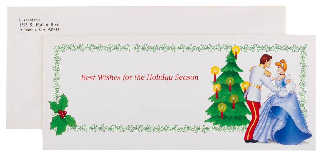 A Walt Disney Company Cinderella Christmas Card.: (Disney, 1980s-90s) A Walt Disney Company Christmas card themed to "Cinderella." Measuring 3.75"x 8.75", the card comes with its envelope and is in very good condition with light wear.