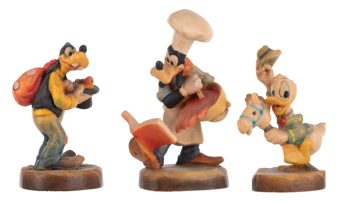 Three Miniature Goofy and Donald Figurines by ANRI.: (ANRI, 1980s-90s) A set of three miniature wooden Goofy and Donald figurines by ANRI of Italy, including two of Goofy. Measuring 2" to 2.5" tall, the figurines are in very good condition with light
