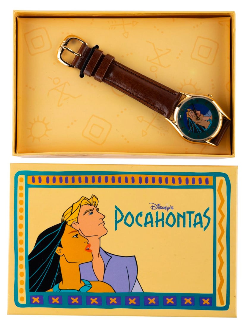 A "Pocahontas" Crew Watch in Original Box.: (Disney, 1995) A "Pocahontas" Feature Animation Crew exclusive watch in its original decorative box. The watch features Pocahontas and John Smith on its face, with a brown leather band and a