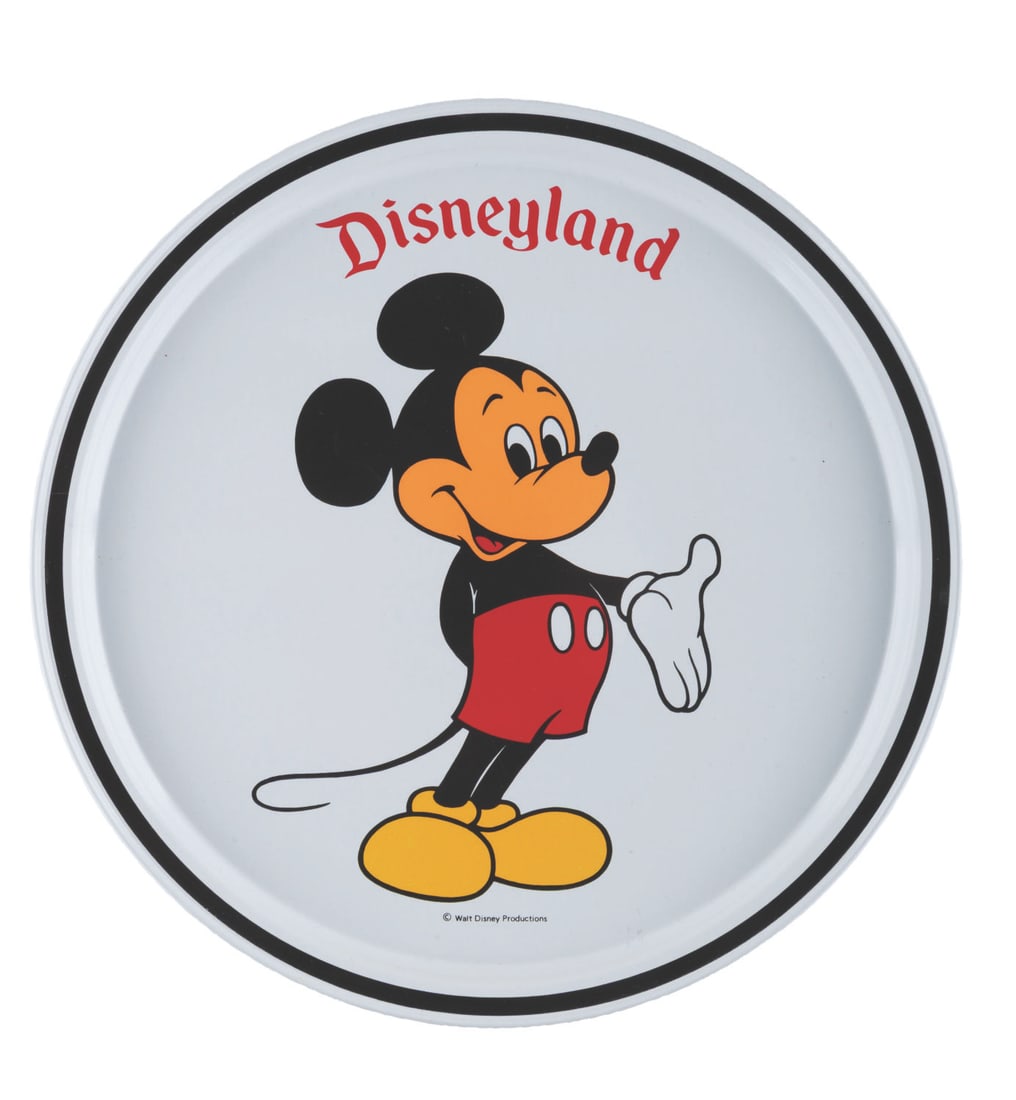 A Disneyland Mickey Mouse Tray.: (Disneyland, 1980s) A Disneyland decorative tray featuring Mickey Mouse. Measuring 10.75" in diameter, the metal tray is in very good condition with light soiling and scuffing.
