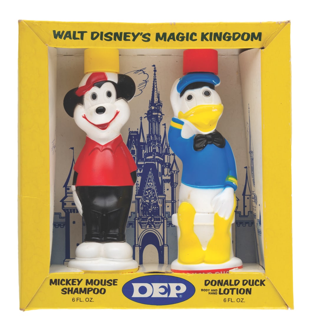 A Walt Disney's Magic Kingdom Shampoo and Lotion Set by Dep.: (Dep, 1960s-70s) A Walt Disney's Magic Kingdom shampoo and lotion set featuring figural containers of Mickey Mouse and Donald Duck. Measuring 8" x 2.5" x 8.25", the set displays in very good