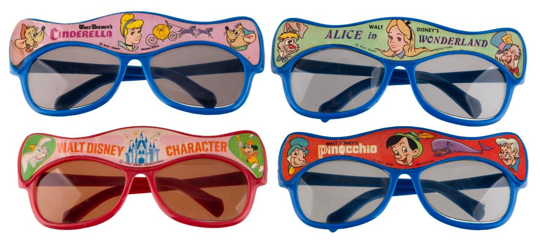 A Collection of Walt Disney Character Sunglasses.: (Disneyland, 1960s-70s) Four pairs of children?s sunglasses featuring Disney characters. Included are Cinderella, Alice in Wonderland, Pinocchio, and Mickey Mouse with Dumbo. Each measuring 2.25" x 5.