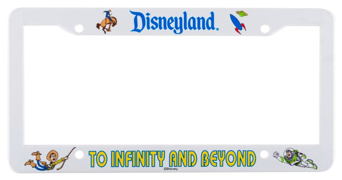 A Disneyland "Toy Story" License Plate Frame.: (Disneyland, 1990s) A "Toy Story" license plate frame from Disneyland, featuring Woody and Buzz. Measuring 6.25" x 12.25", the license plate cover is in good condition with scratches and wear.