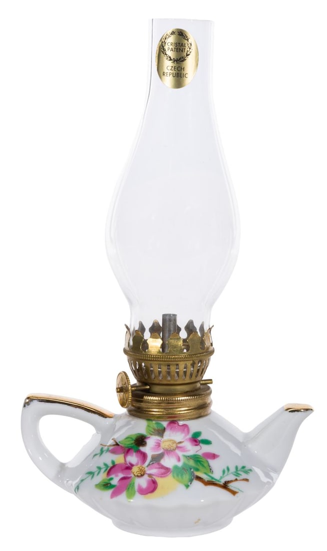 A Ruggles Floral Tea Pot-Shaped Ceramic Oil Lamp.: (Ruggles, 1955-64) A decorative hurricane oil lamp in the shape of a tea pot. This was sold as a souvenir in the Ruggles China shop at Disneyland?s Main Street U.S.A. Measuring 4.5" x 3.5" x 7.75" hig