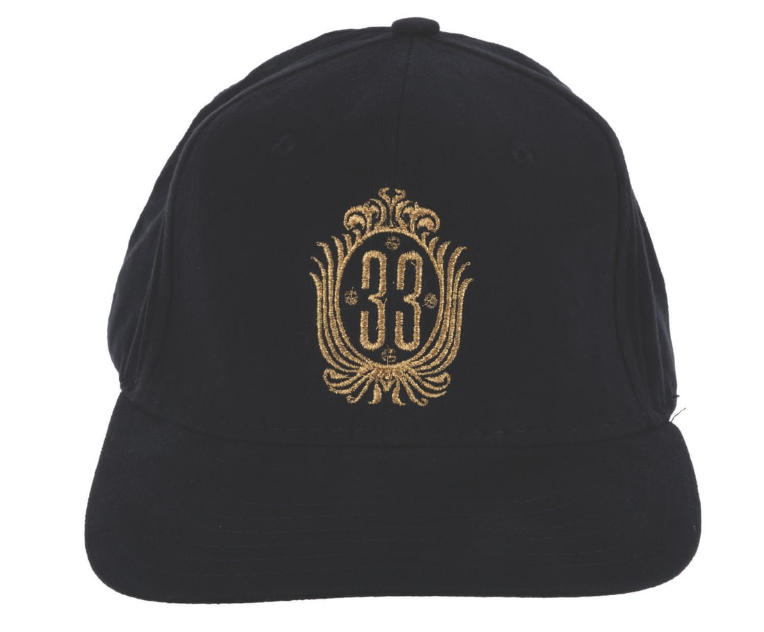 A Club 33 Baseball Hat.: (Disneyland, 2000s) An embroidered baseball cap from the exclusive Club 33, featuring the logo in delicate gold on the front and "Club 33 Disneyland" on the reverse. The one size fits most hat, with a