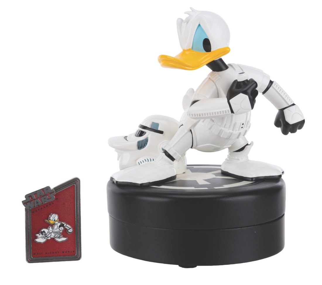 A Donald Duck Stormtrooper Figurine and Pin. (1 of 9)