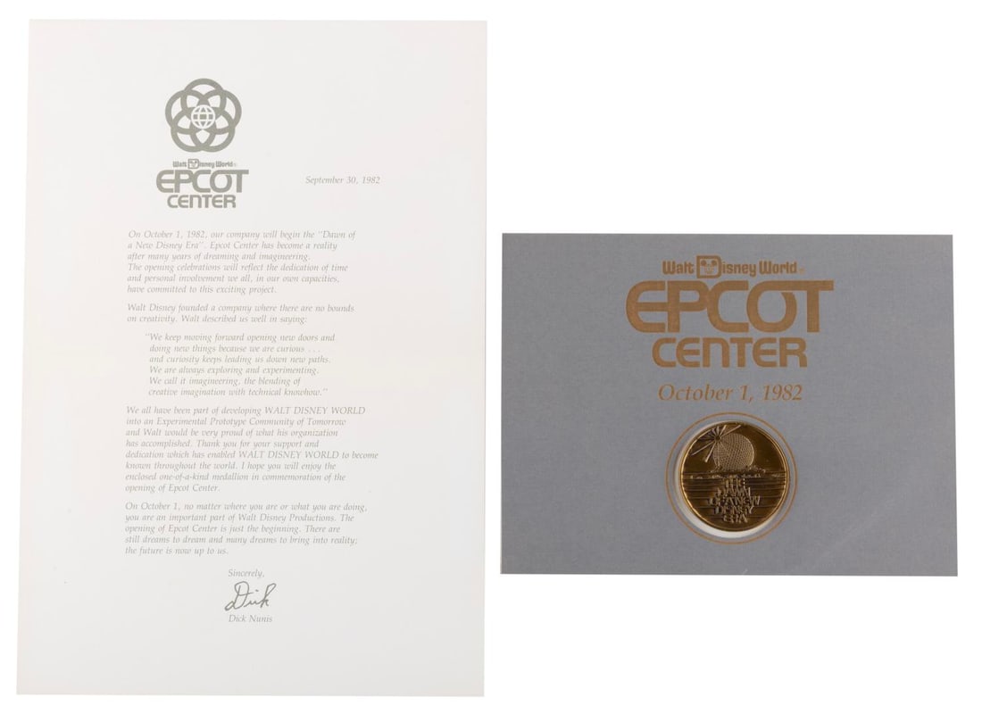 A WED Imagineering 1982 EPCOT Opening Medallion.: (EPCOT, 1982) A very rare medallion given to WED Imagineers to commemorate the grand opening of EPCOT Center on October 1, 1982. The 1.5" diameter medallion is attached to a 6.75" x 5.25" card, and