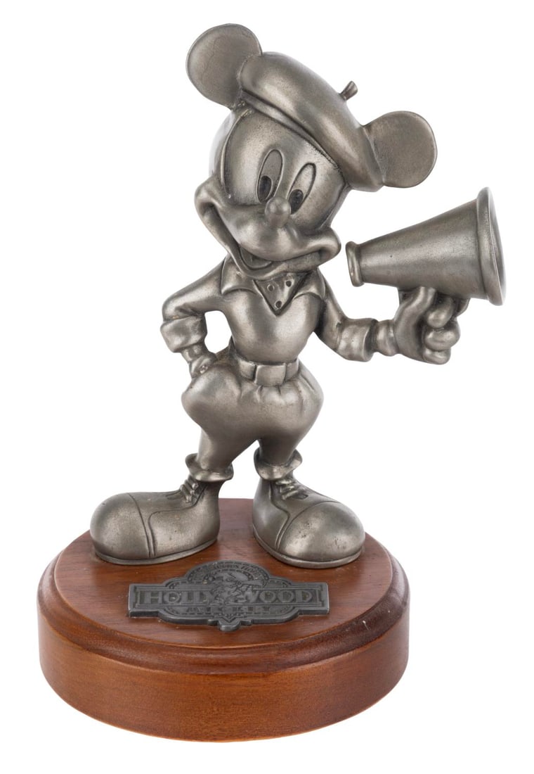 A Hollywood Mickey Statue.: (Hudson, 1980s-90s) A Hollywood Mickey statue, numbered 188/2500 and manufactured by Hudson. Measuring 6.5" tall and 4" in diameter, the pewter statue on a wooden base is in good condition with