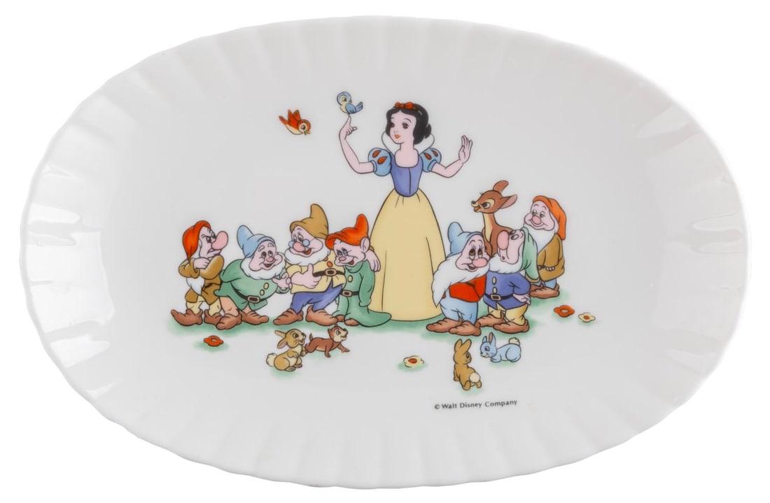 A "Snow White and the Seven Dwarfs" Ceramic Oval Plate.: (Tokyo Disneyland, 1986) A ceramic oval dish featuring "Snow White and the Seven Dwarfs" from Tokyo Disneyland. Measuring 6.75" x 10.5" the plate is in very good condition with light soiling and