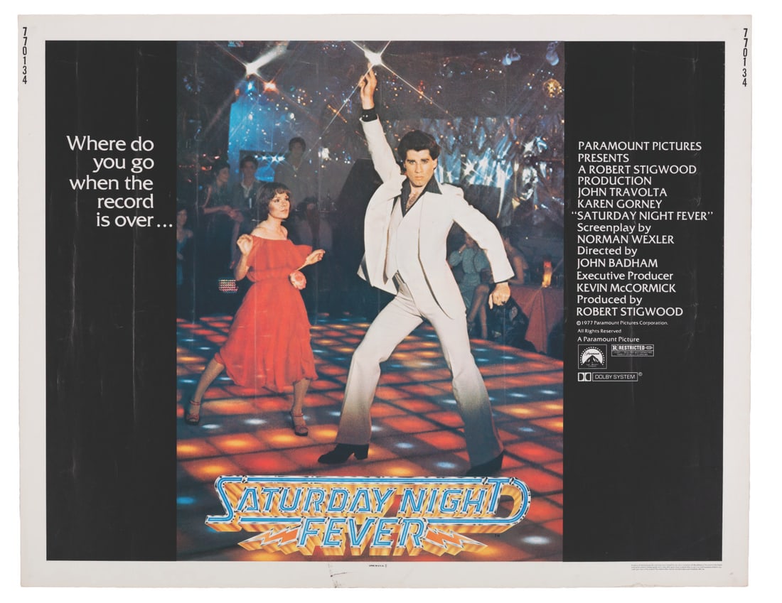 A "Saturday Night Fever" Half-Sheet.: (Paramount, 1977) A half-sheet for "Saturday Night Fever" starring John Travolta. The decade-defining disco film turned Travolta into an international star, and its Bee Gees-packed soundtrack remains