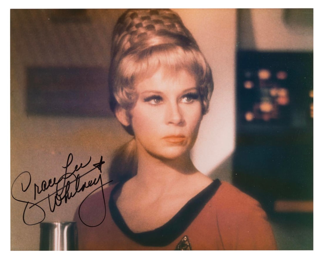 A Grace Lee Whitney Signed Star Trek Photograph.: (Paramount, 1990s) A signed photograph of Grace Lee Whitney as Yeoman Rand in the original "Star Trek" television series. Measuring 8" x 10", the autographed photo is in fine condition.