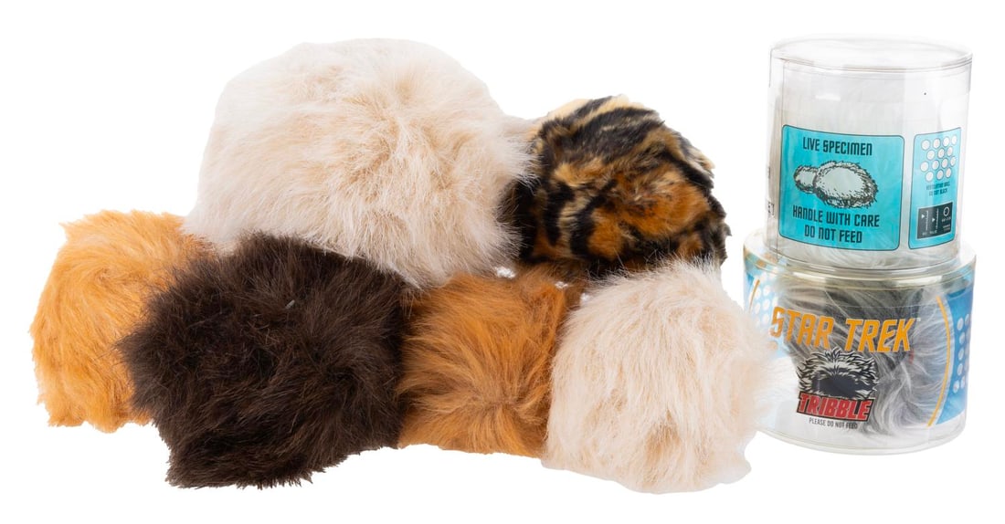 A Collection of Plush Star Trek Tribbles.: (Paramount, 2000-2015) Eight plush tribbles as seen on "Star Trek" and "Star Trek: Deep Space Nine." The two in plastic containers are plush, while the others each have built-in sound features. Only t