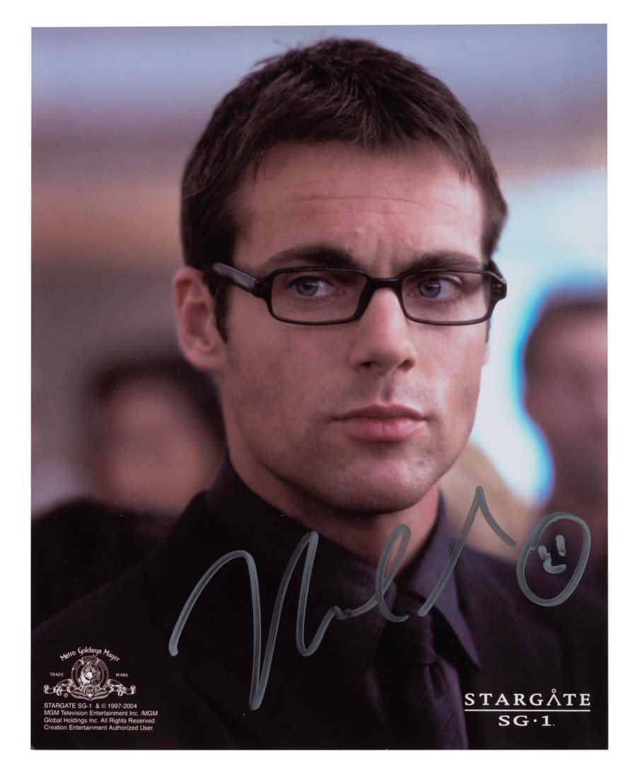 A Michael Shanks Signed "Stargate SG-1" Photograph.: (MGM, 2000s) An autographed photograph of Michael Shanks as Dr. Daniel Jackson in Stargate SG-1. Measuring 8" x 10", the signed photo is in very good condition with light handling wear.