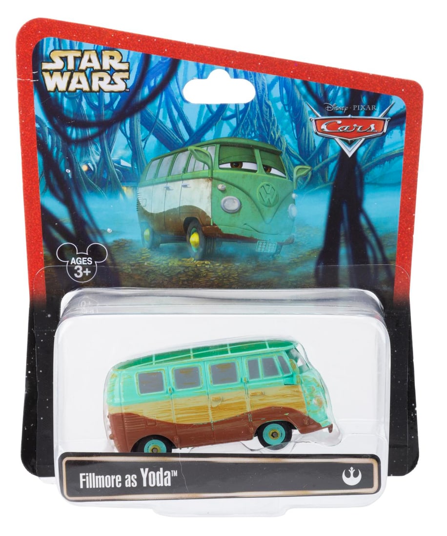 A Cars/Star Wars Fillmore as Yoda Diecast Toy.: (Disney, 2013) A toy of Fillmore from "Cars" as Yoda. Measuring 3" long, the die-cast toy is in fine condition sealed on the original card. The card is in very good condition with a small scuff at top