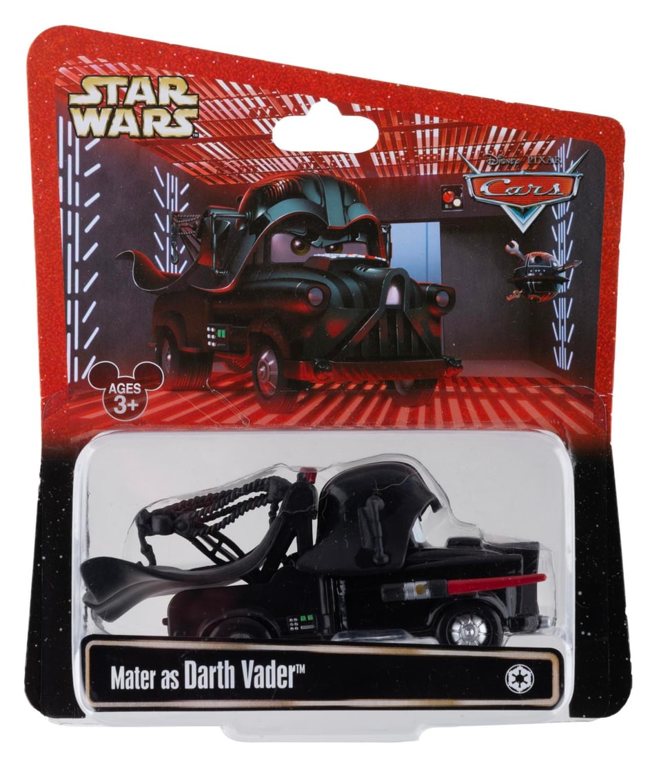 A Cars/Star Wars Mater as Darth Vader Toy.: (Disney, 2013) A toy of Mater from "Cars" as Darth Vader. Measuring 4" long the toy is in fine condition on the original very good condition card.
