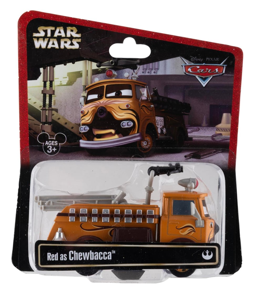 A Cars/Star Wars Red as Chewbacca Toy.: (Disney, 2013) A toy of Red the Fire truck from "Cars" as Chewbacca. Measuring 4" long the toy is in fine condition, still on the original very good condition card.