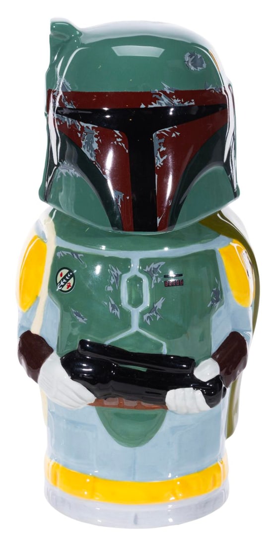 A Star Wars Boba Fett Stein.: (Beeline Creative, 2015) A ceramic stein of Boba Fett, released in 2015 ahead of the larger Think Geek barware line in 2016. Measuring 6.5" x 5" x 9" high, the stein is in fine unused condition.