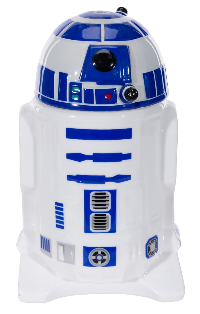 A Star Wars R2-D2 Stein.: (Beeline Creative, 2015) A ceramic stein of R2-D2, released in 2015 ahead of the larger Think Geek barware line in 2016. Measuring 6.5" x 5.25" x 9.25" high, the stein is in very good condition.