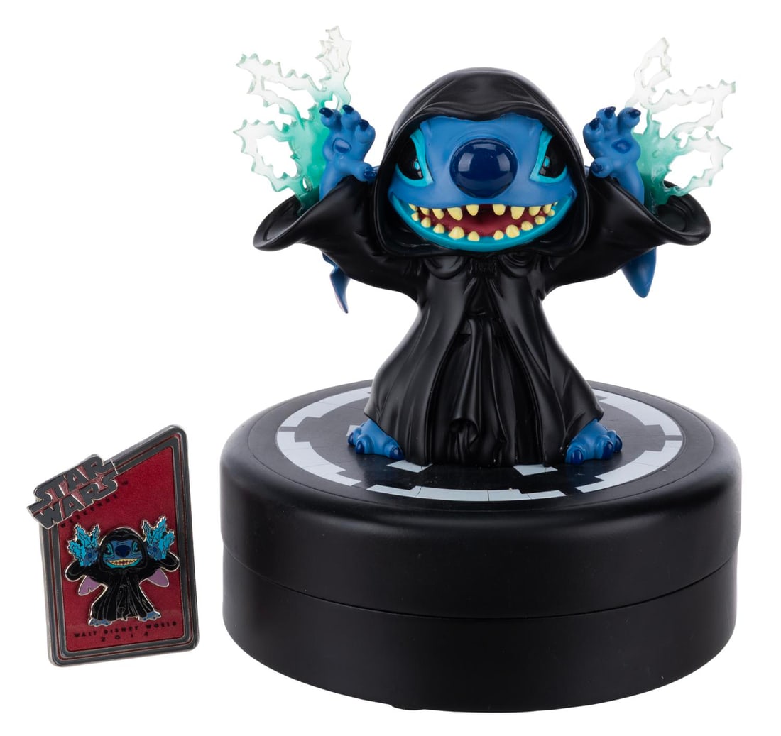 A Star Wars Stitch as Emperor Palpatine Medium Fig.: (Walt Disney World, 2014) A Medium Fig of Stitch as Emperor Palpatine, released exclusively during Star Wars Weekends at Walt Disney World in a limited edition of 1977. Included in the base is a pin o