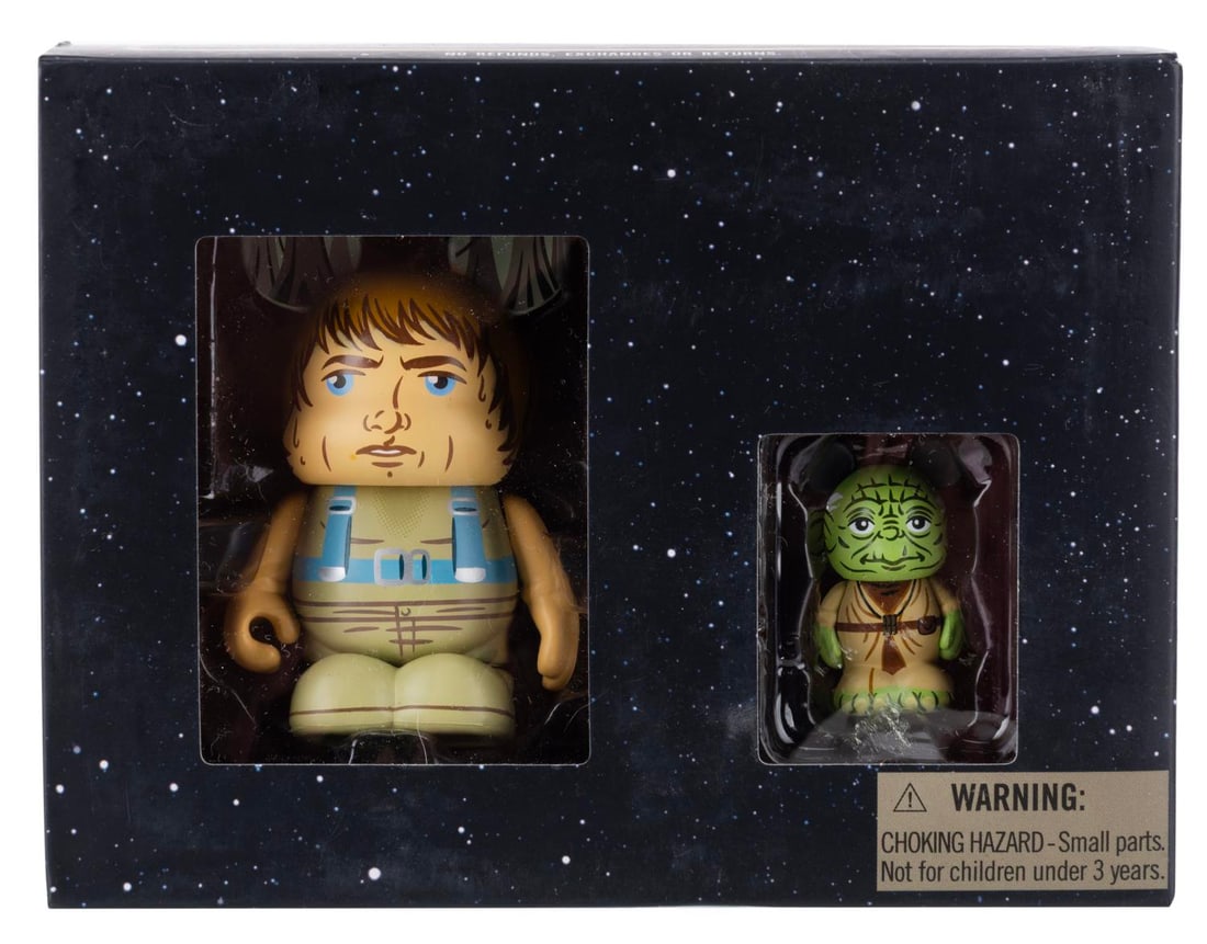 A "Star Wars" Luke Skywalker and Yoda Vinylmation Set.: (Disney Parks, 2014) A set of Dagobah Luke and Yoda Vinylmation figurines, exclusively sold at the Disney Parks in a limited edition of 2000. Measuring 3" and 1.5" each respectively, the Star Wars fig